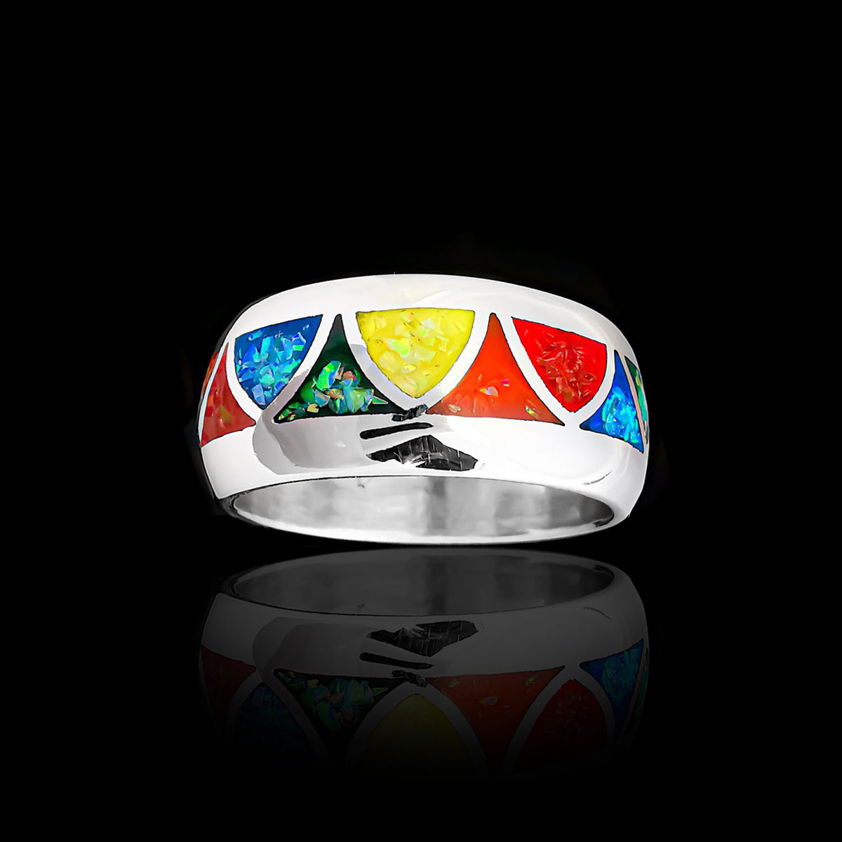 vitelpharma's Wide Band Rainbow Pride Triangles Ring, handcrafted in sterling silver is inlaid with red, orange, yellow, green, and blue opals in a rainbow pattern